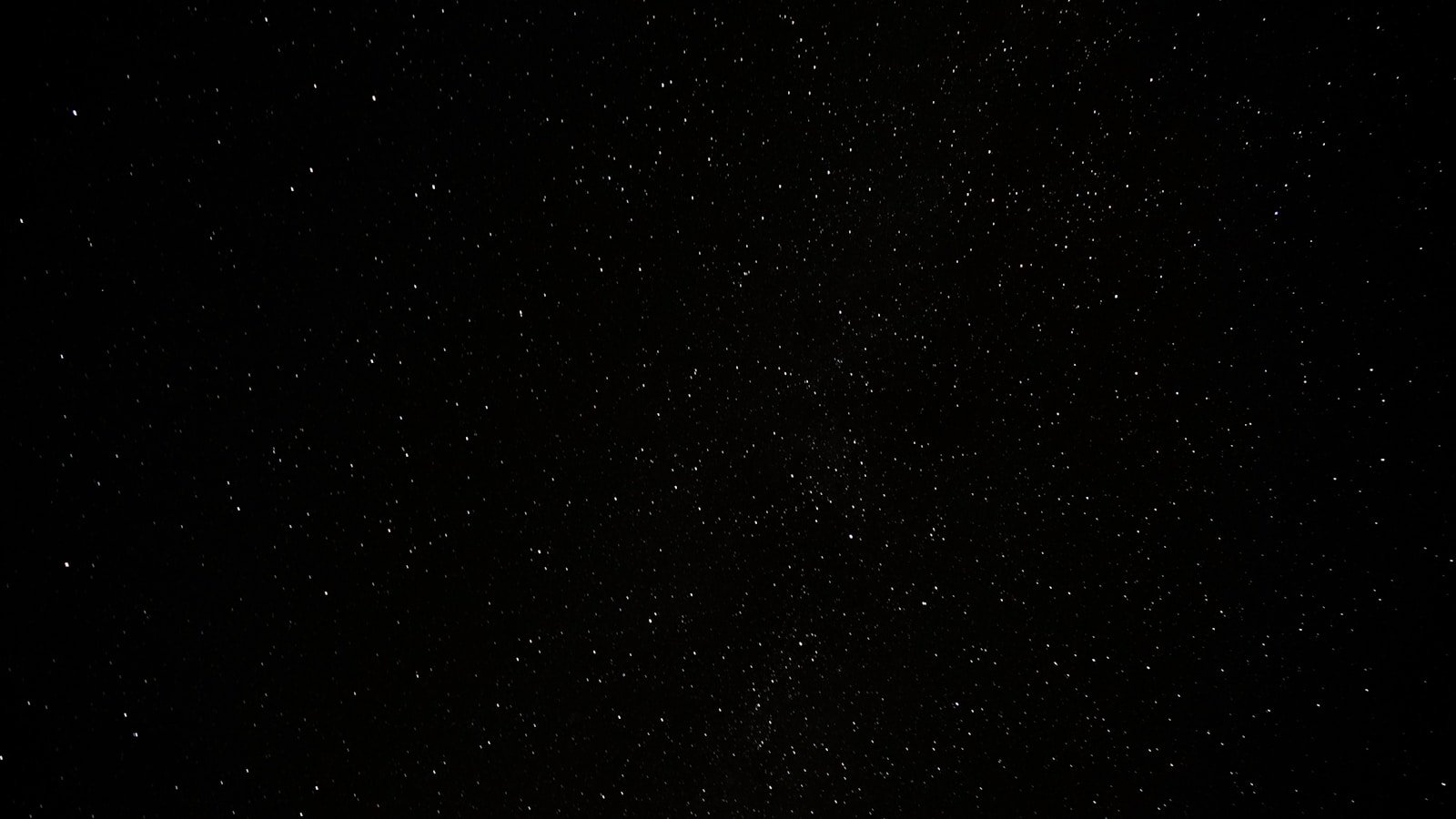 a black sky with a lot of stars